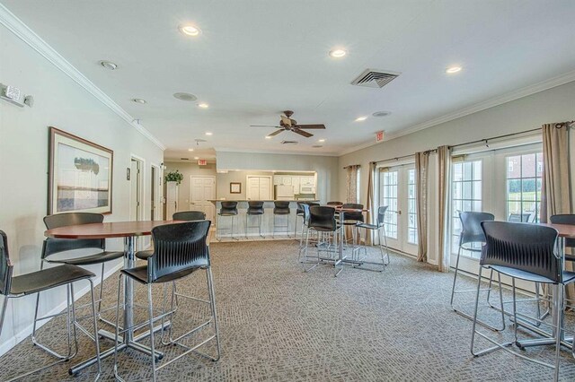 7102 Flagship Dr Unit 8, Madison, WI 53719 - carpeted dining space featuring recessed lighting, a ceiling fan, ornamental molding, french doors, and baseboards