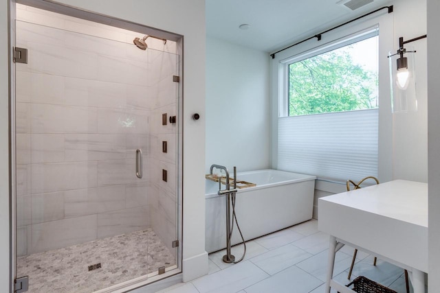 810 Farwell Dr, Madison, WI 53704 - full bath featuring a shower stall, a soaking tub, and tile patterned flooring