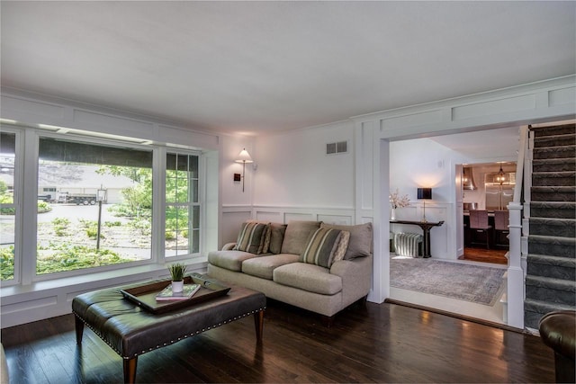 810 Farwell Dr, Madison, WI 53704 - living area featuring a decorative wall, hardwood / wood-style flooring, and stairway