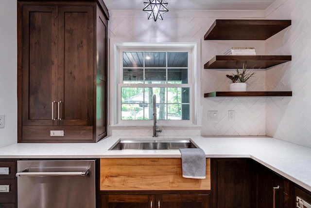 810 Farwell Dr, Madison, WI 53704 - kitchen with stainless steel dishwasher, a sink, backsplash, dark brown cabinetry, and light countertops