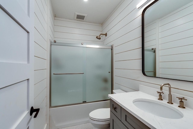 810 Farwell Dr, Madison, WI 53704 - full bath featuring toilet, vanity, enclosed tub / shower combo, and wooden walls