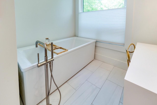 810 Farwell Dr, Madison, WI 53704 - full bathroom featuring a freestanding tub and tile patterned flooring