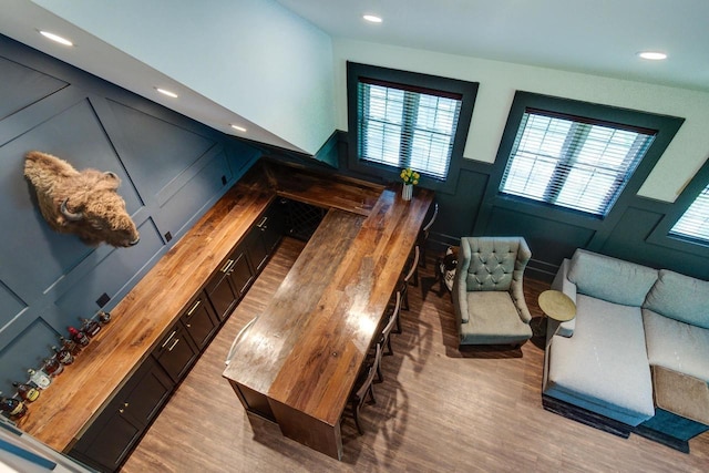 810 Farwell Dr, Madison, WI 53704 - living room featuring light wood-type flooring, a decorative wall, a wainscoted wall, and recessed lighting