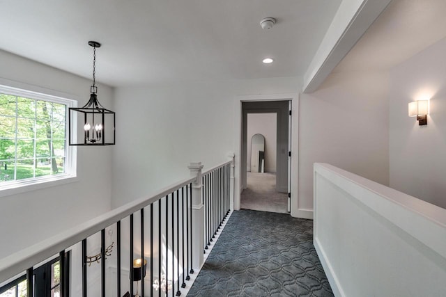 810 Farwell Dr, Madison, WI 53704 - corridor with a chandelier, dark carpet, recessed lighting, and an upstairs landing