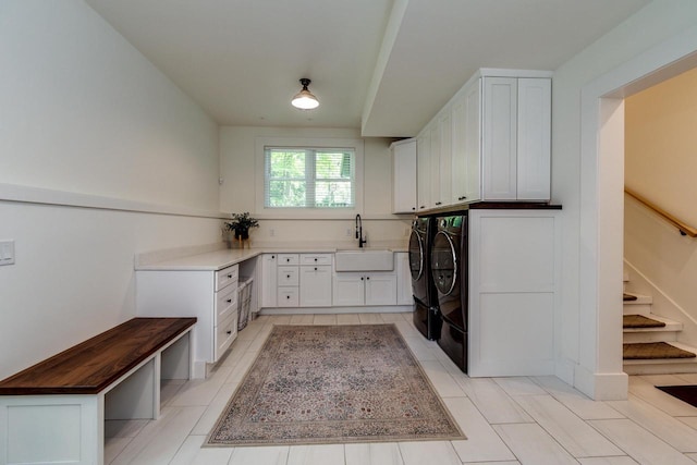 810 Farwell Dr, Madison, WI 53704 - laundry area with cabinet space, separate washer and dryer, and light tile patterned flooring