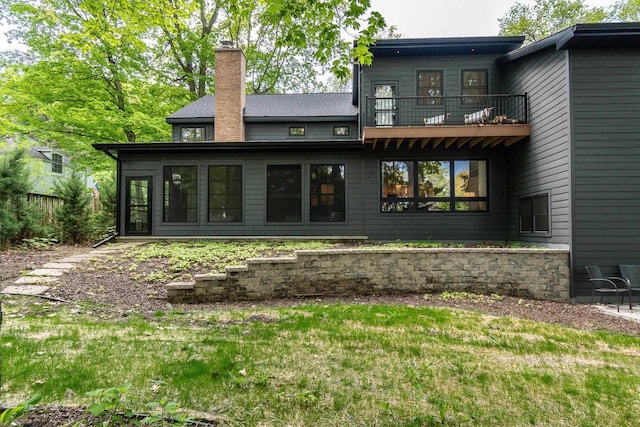 810 Farwell Dr, Madison, WI 53704 - back of property featuring a balcony and a chimney