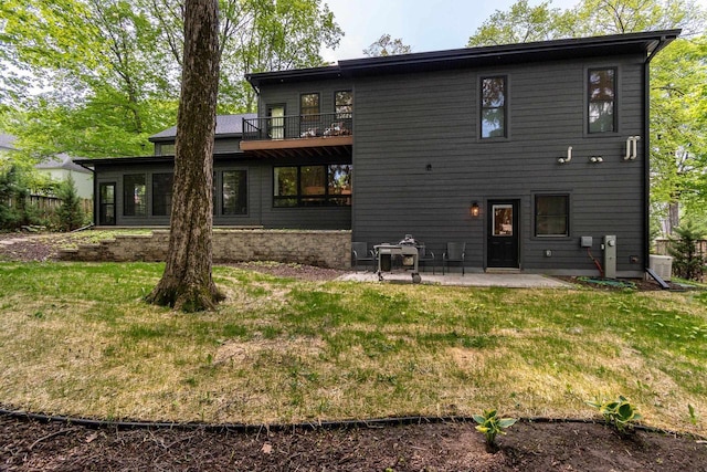810 Farwell Dr, Madison, WI 53704 - rear view of house with a lawn and a patio area