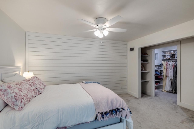810 Farwell Dr, Madison, WI 53704 - bedroom featuring light colored carpet, a closet, ceiling fan, a spacious closet, and baseboards