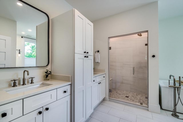 810 Farwell Dr, Madison, WI 53704 - bathroom featuring a shower stall, two vanities, and tile patterned flooring