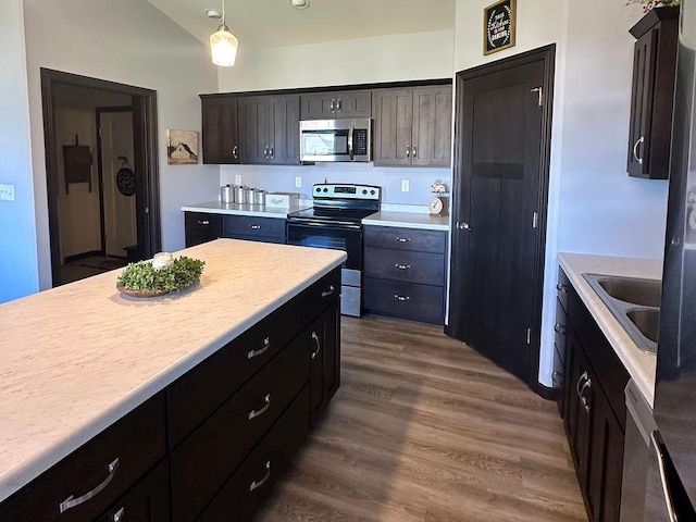 8505 Hinner Springs Dr, Weston, WI 54476 - kitchen with appliances with stainless steel finishes, light countertops, dark wood-type flooring, hanging light fixtures, and a sink