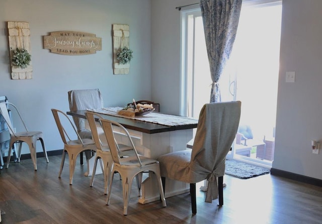 8505 Hinner Springs Dr, Weston, WI 54476 - dining area with dark wood-style flooring and baseboards