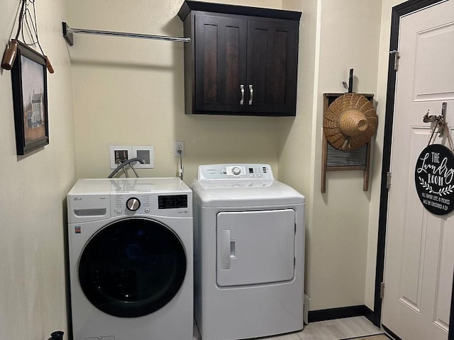 8505 Hinner Springs Dr, Weston, WI 54476 - clothes washing area with cabinet space, independent washer and dryer, and baseboards