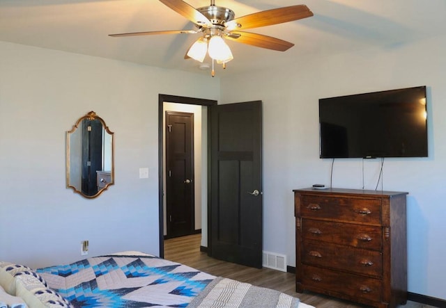 8505 Hinner Springs Dr, Weston, WI 54476 - bedroom featuring wood finished floors, a ceiling fan, and baseboards