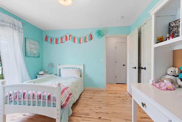 2074 Sandy Springs Rd, De Pere, WI 54115 - bedroom with light wood-style floors and baseboards
