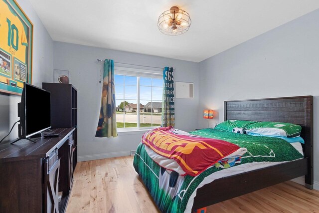 2074 Sandy Springs Rd, De Pere, WI 54115 - bedroom featuring light wood-type flooring and baseboards