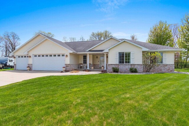 2074 Sandy Springs Rd, De Pere, WI 54115 - ranch-style home with an attached garage, covered porch, a front lawn, concrete driveway, and brick siding