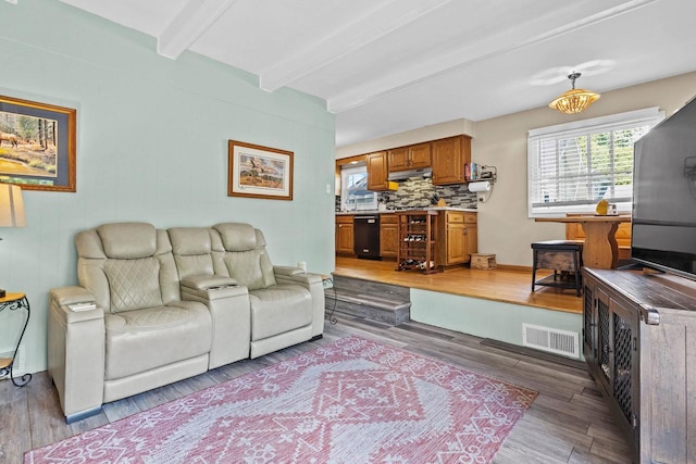 1333 W Lawrence St, Appleton, WI 54914 - living area with beamed ceiling and light wood-type flooring