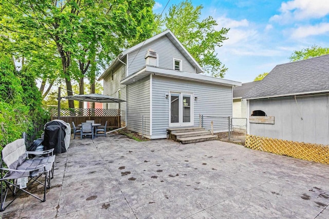 1333 W Lawrence St, Appleton, WI 54914 - rear view of house with a patio, outdoor dining space, and entry steps