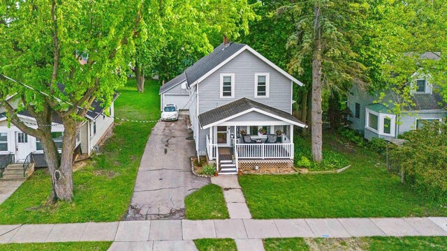 1333 W Lawrence St, Appleton, WI 54914 - view of front of home with a porch, asphalt driveway, and a front yard