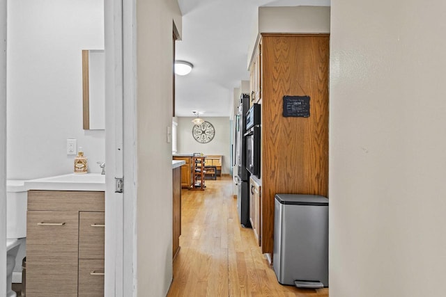 1333 W Lawrence St, Appleton, WI 54914 - hall with light wood-style floors