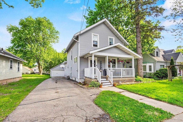 1333 W Lawrence St, Appleton, WI 54914 - view of front facade with a porch, an outbuilding, a garage, and a front lawn