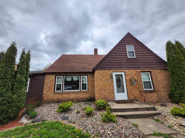 805 S Wacouta Ave, Prairie Du Chien, WI 53821 - view of front of home with a chimney and brick siding