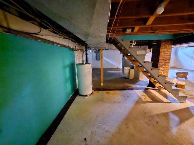 805 S Wacouta Ave, Prairie Du Chien, WI 53821 - unfinished basement featuring gas water heater, stairs, and electric panel