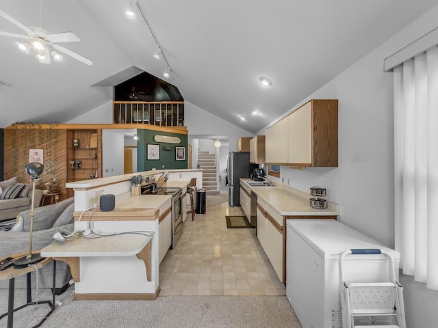 911 Fawn Ln, Port Edwards, WI 54469 - kitchen featuring stainless steel appliances, ceiling fan, lofted ceiling, light countertops, and open floor plan