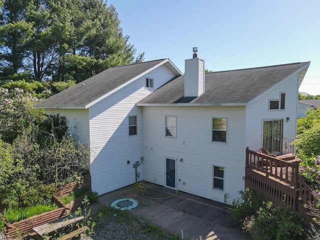 911 Fawn Ln, Port Edwards, WI 54469 - rear view of property featuring a patio area, a chimney, and a wooden deck