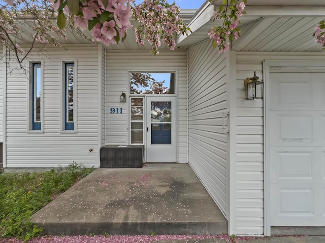 911 Fawn Ln, Port Edwards, WI 54469 - entrance to property featuring a garage and a patio
