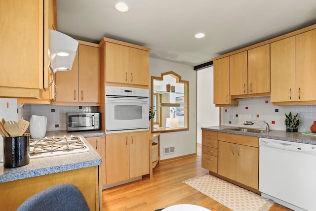 5406 Marsha Dr, Madison, WI 53705 - kitchen with white appliances, a sink, light brown cabinets, decorative backsplash, and recessed lighting