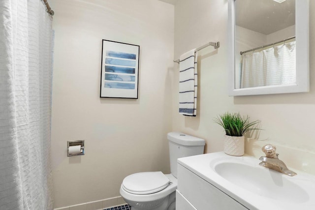 5406 Marsha Dr, Madison, WI 53705 - bathroom with toilet, vanity, and a shower with shower curtain