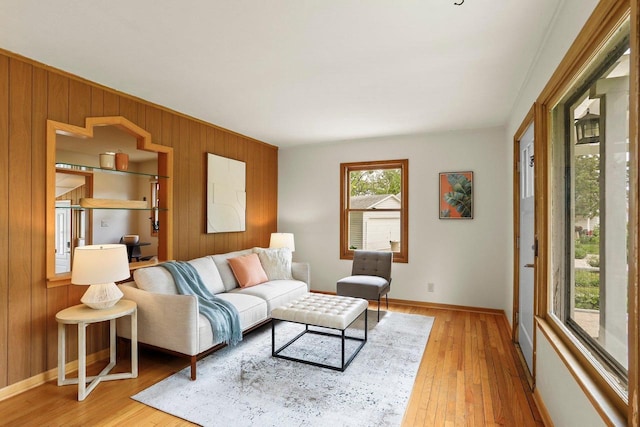 5406 Marsha Dr, Madison, WI 53705 - living area featuring wooden walls, light wood-type flooring, and baseboards
