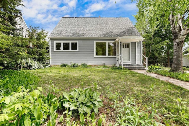 5406 Marsha Dr, Madison, WI 53705 - view of front facade featuring a shingled roof, a front lawn, and entry steps