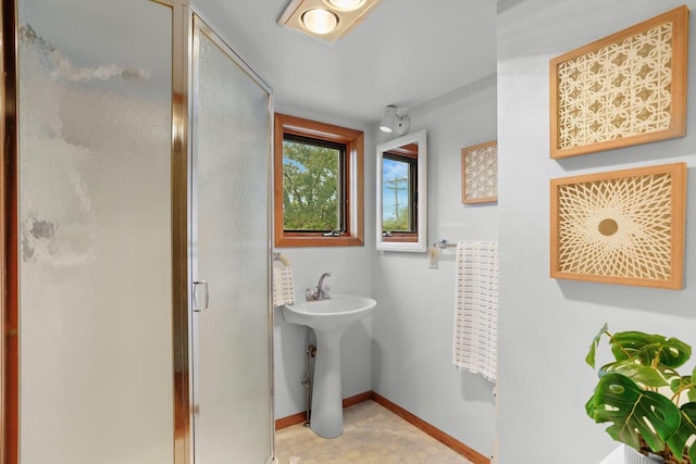5406 Marsha Dr, Madison, WI 53705 - bathroom with a shower stall, baseboards, and a sink