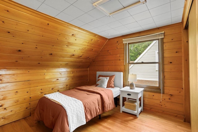 5406 Marsha Dr, Madison, WI 53705 - bedroom featuring light wood-style floors, wood walls, and lofted ceiling