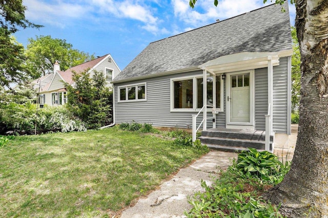5406 Marsha Dr, Madison, WI 53705 - view of front of property featuring a shingled roof and a front lawn