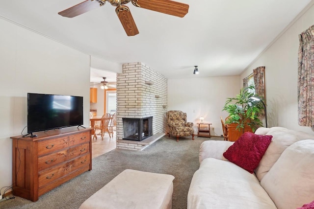 4901 Ralph Cir, Madison, WI 53714 - carpeted living room featuring a ceiling fan and a fireplace