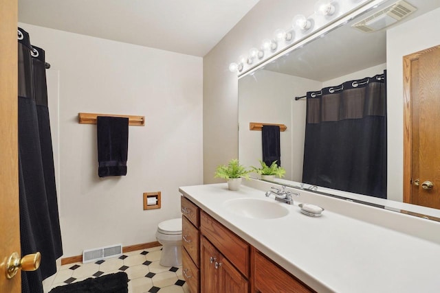 4901 Ralph Cir, Madison, WI 53714 - bathroom featuring tile patterned floors, toilet, vanity, baseboards, and a shower with curtain