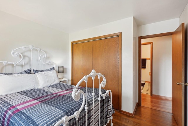 4901 Ralph Cir, Madison, WI 53714 - bedroom featuring wood finished floors, baseboards, and a closet