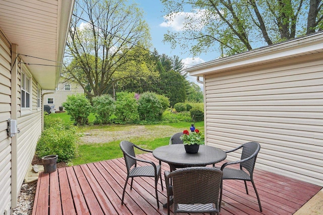 4901 Ralph Cir, Madison, WI 53714 - wooden deck with outdoor dining space and a yard