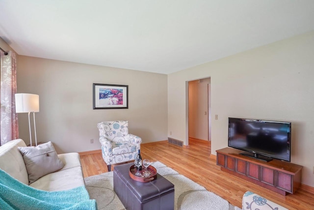 4901 Ralph Cir, Madison, WI 53714 - living room featuring light wood finished floors and baseboards