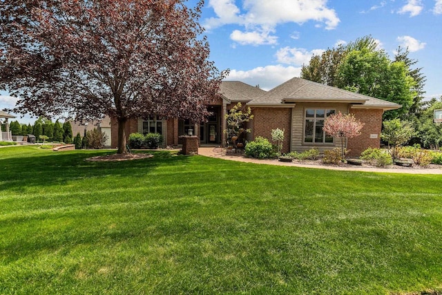 441 E Apple Creek Rd, Appleton, WI 54913 - view of front of home featuring brick siding, a front yard, and roof with shingles