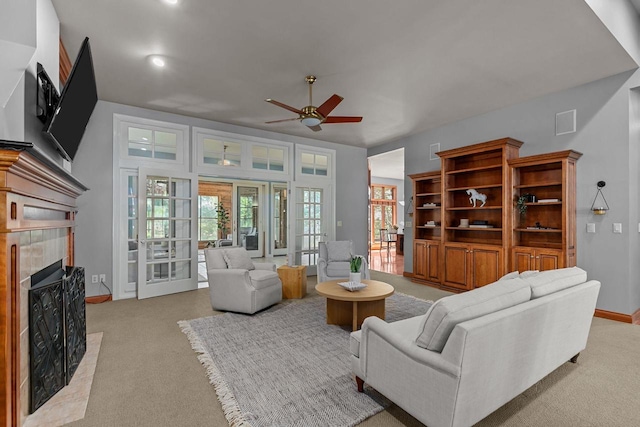 441 E Apple Creek Rd, Appleton, WI 54913 - living area featuring ceiling fan, a tiled fireplace, light colored carpet, baseboards, and recessed lighting