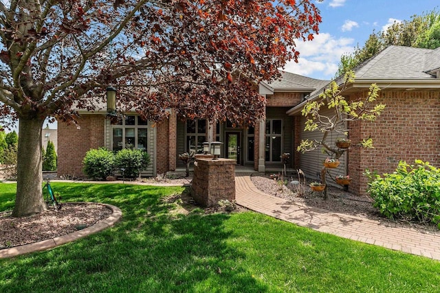 441 E Apple Creek Rd, Appleton, WI 54913 - back of property featuring a yard, a shingled roof, and brick siding
