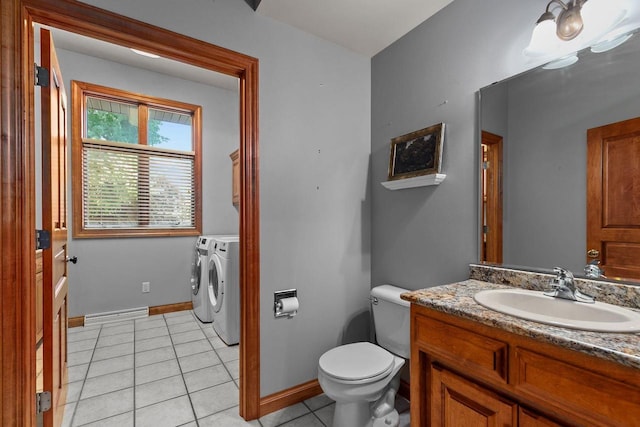 441 E Apple Creek Rd, Appleton, WI 54913 - bathroom featuring washing machine and dryer, tile patterned flooring, toilet, baseboards, and vanity