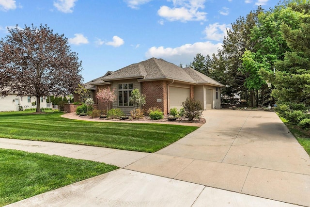 441 E Apple Creek Rd, Appleton, WI 54913 - view of front of house with brick siding, an attached garage, concrete driveway, and a front lawn