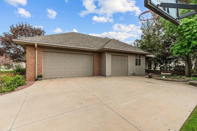 441 E Apple Creek Rd, Appleton, WI 54913 - view of home's exterior with brick siding, a garage, roof with shingles, and driveway