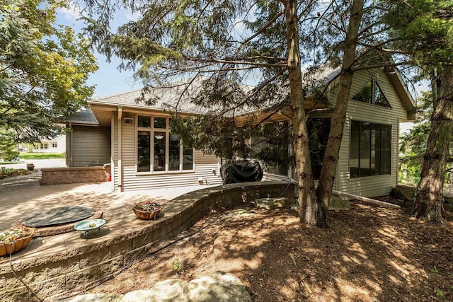 441 E Apple Creek Rd, Appleton, WI 54913 - rear view of property featuring a patio area and roof with shingles