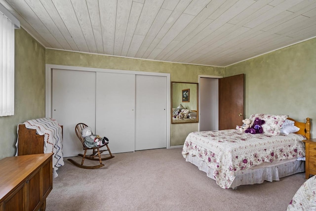 bedroom featuring wooden ceiling and carpet flooring